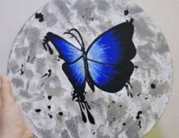 Blue butterfly with textured background