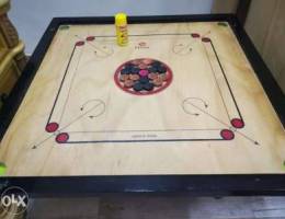 Carrom board with coins