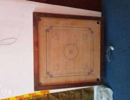 Carrom board with coins