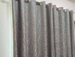 Pair of curtains with pole.