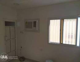 room, bathroom, and kitchen with air condi...