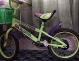 Child bycycle with side wheel