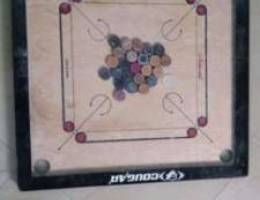 Carrom board with coins (less used)