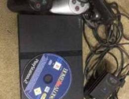 Playstation 2 with 2 remotes 1 cd 2 live c...