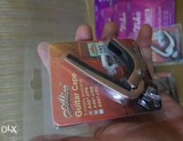 Guitar capo, strings, bridge pin accesorie...