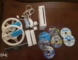 Nintendo Wii Console with games + 2 steeri...