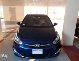 Blue Hyundai accent Hatchback