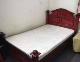 Double bed with matress and table for urge...