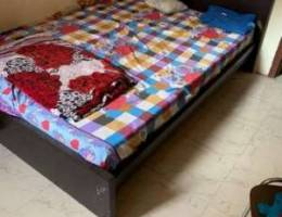 king size bed with mattress and cupboard